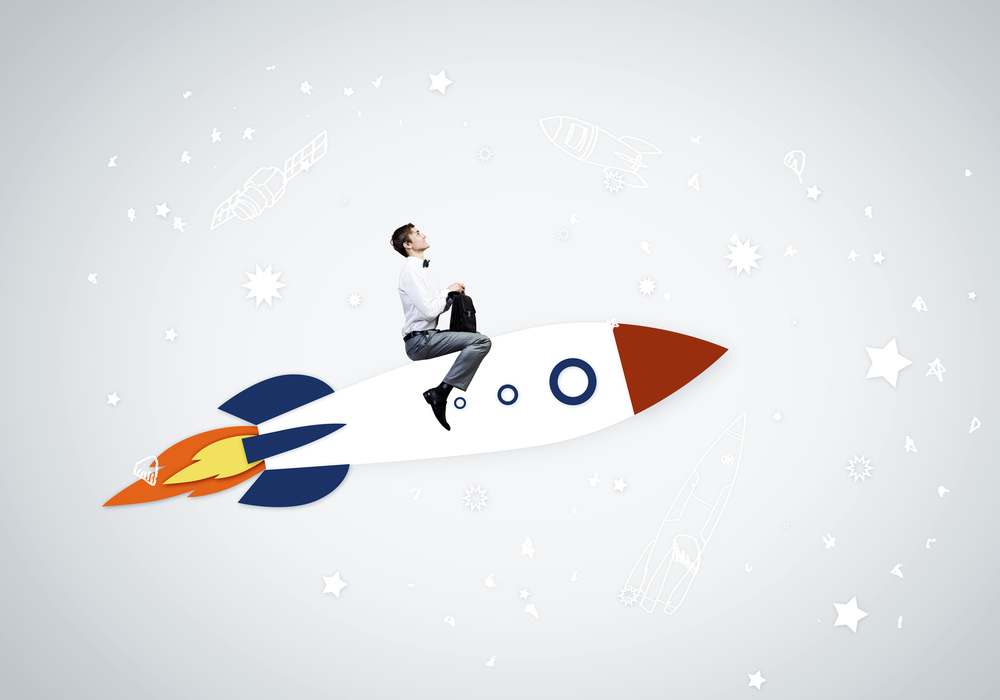 Young businessman,an flying in sky on drawn rocket Young businessman,an flying in sky on drawn rocket